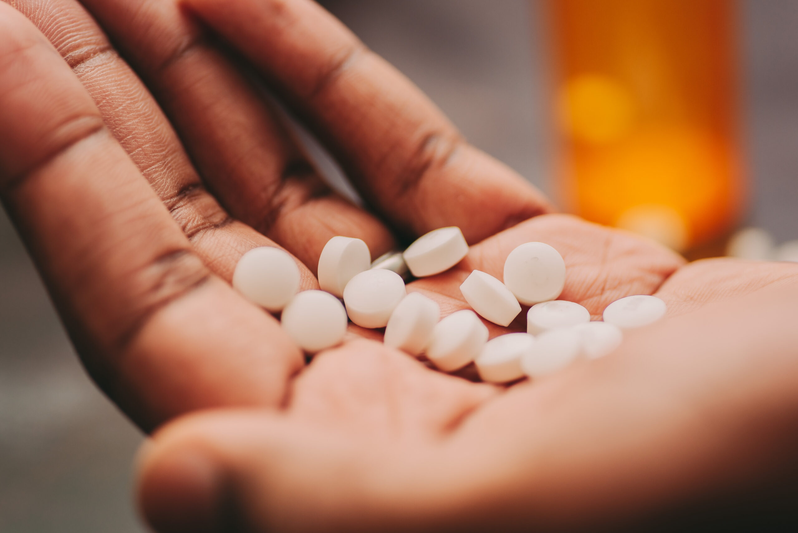 A man holding Opiate addiction treatment medication